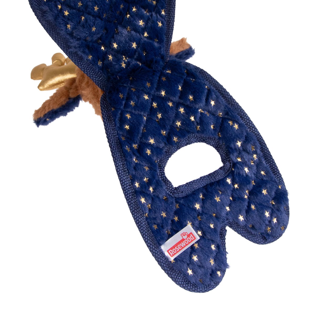 Close-up of Rosewood Ren Reindeer plush dog toy showing navy blue fabric decorated with gold stars, tugging opening and Rosewood brand label.