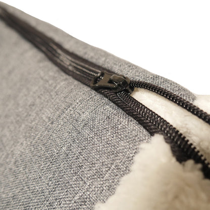 Close-up of the zip on the Rosewood Snuggle Plush 2-in-1 Cat Comfort Den showing the grey fabric and cream plush material