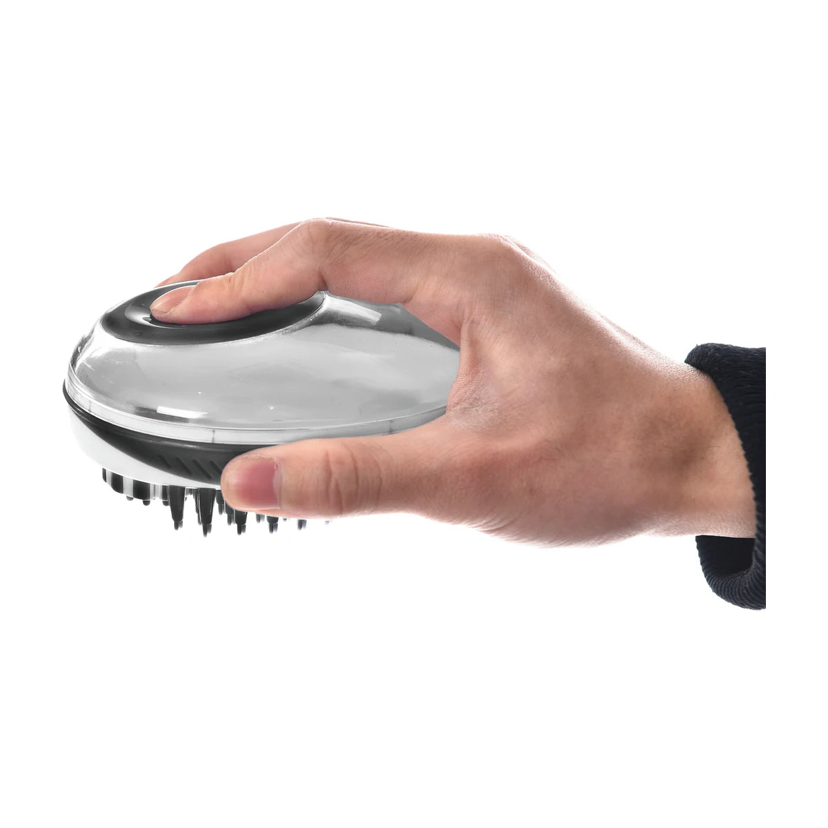 Hand holding Rosewood 2-in-1 bath and groom brush for cats and dogs, press button shampoo dispensing design