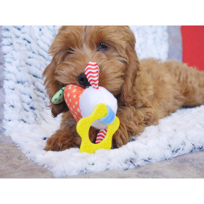 Puppy playing with Rosewood Little Nippers Laughy Lamb soft teething toy with plush body and rubber star handle