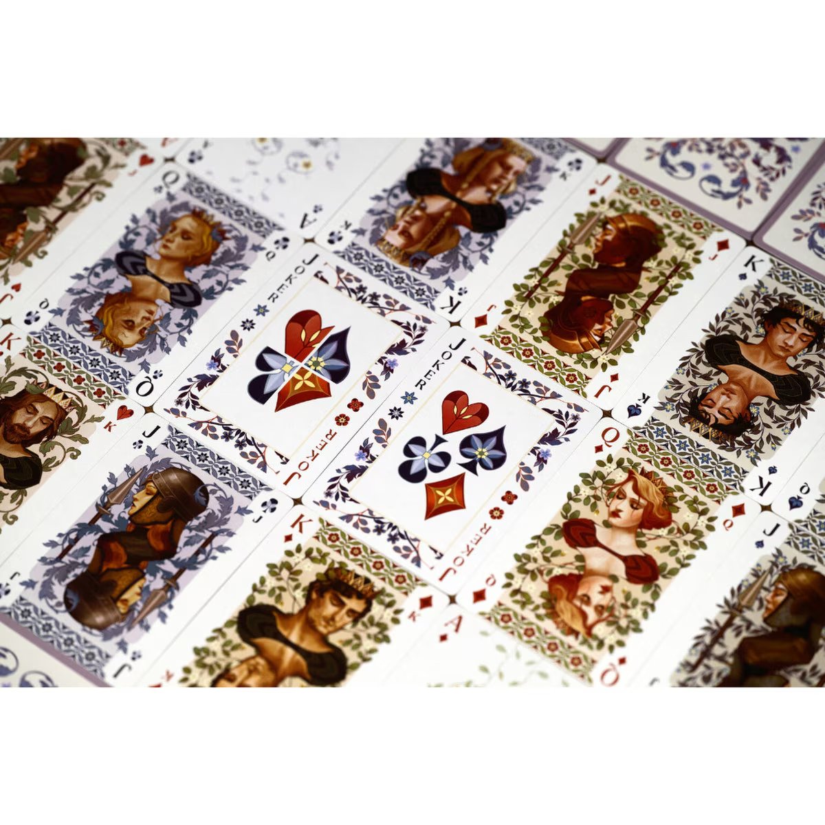 Close-up of Solitaire illustrated playing cards showing classic suits and detailed character artwork