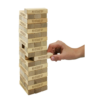 Stack Up wooden stacking game with hand pulling a block from the tower