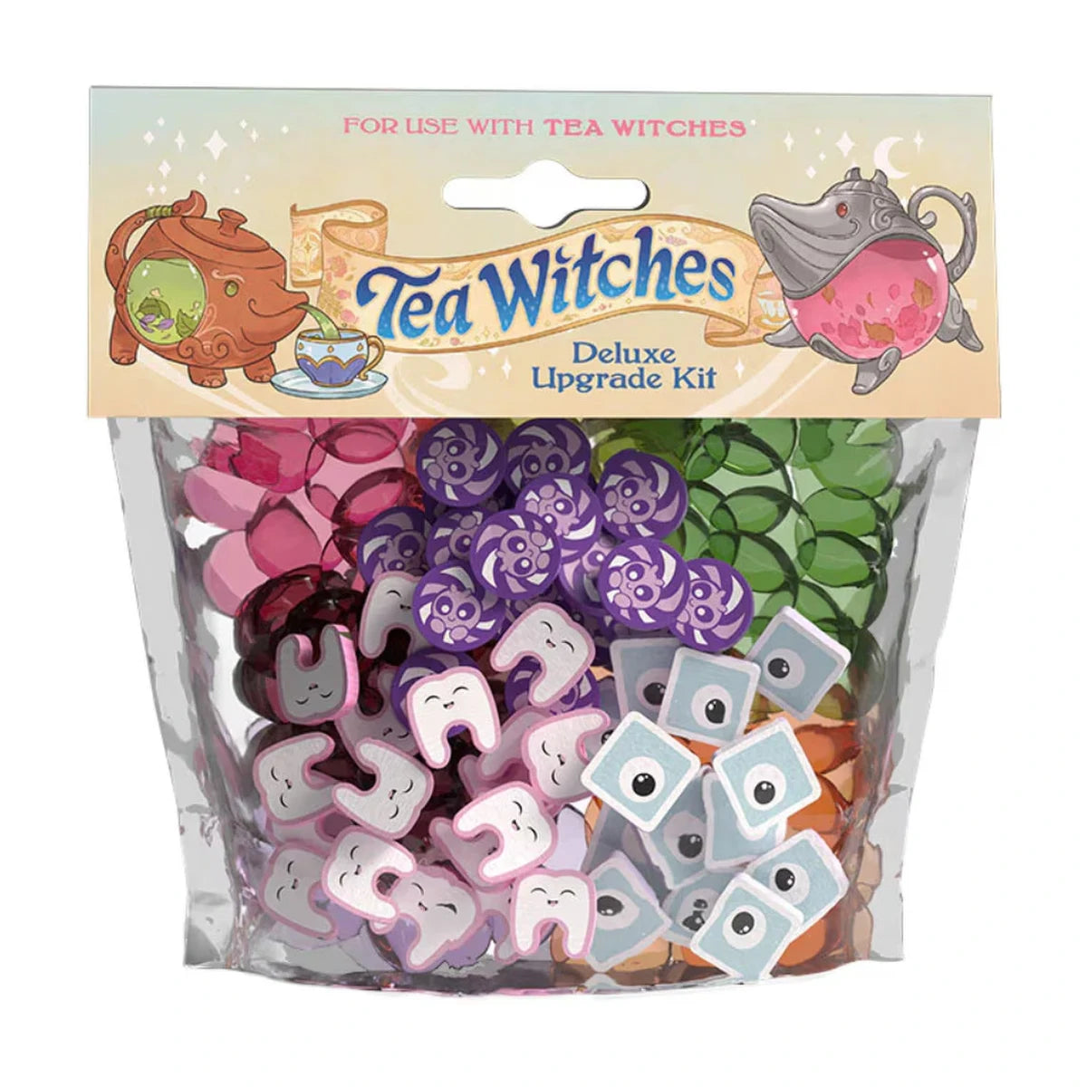 Tea Witches Deluxe Upgrade Kit showing wooden topping pieces and acrylic tea tokens for the Tea Witches board game