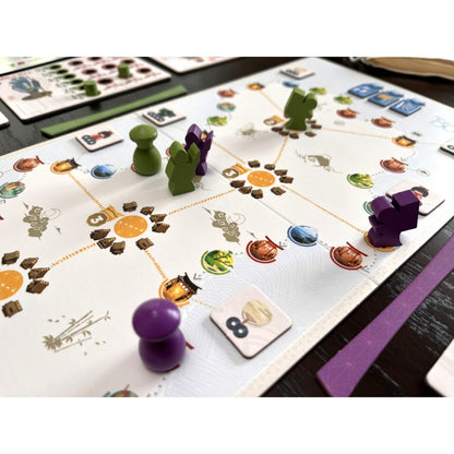 Tokaido Duo board game gameplay with board, tokens and player pieces