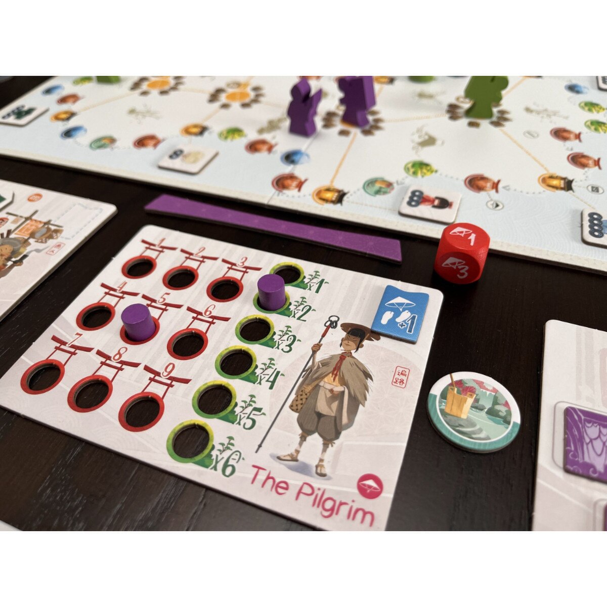 Tokaido Duo pilgrim player board with tokens and gameplay pieces
