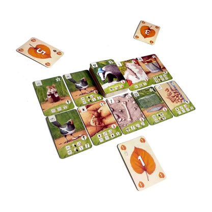 Tricky Badger Card Game play area showing animal and object collection cards with numbered leaf cards